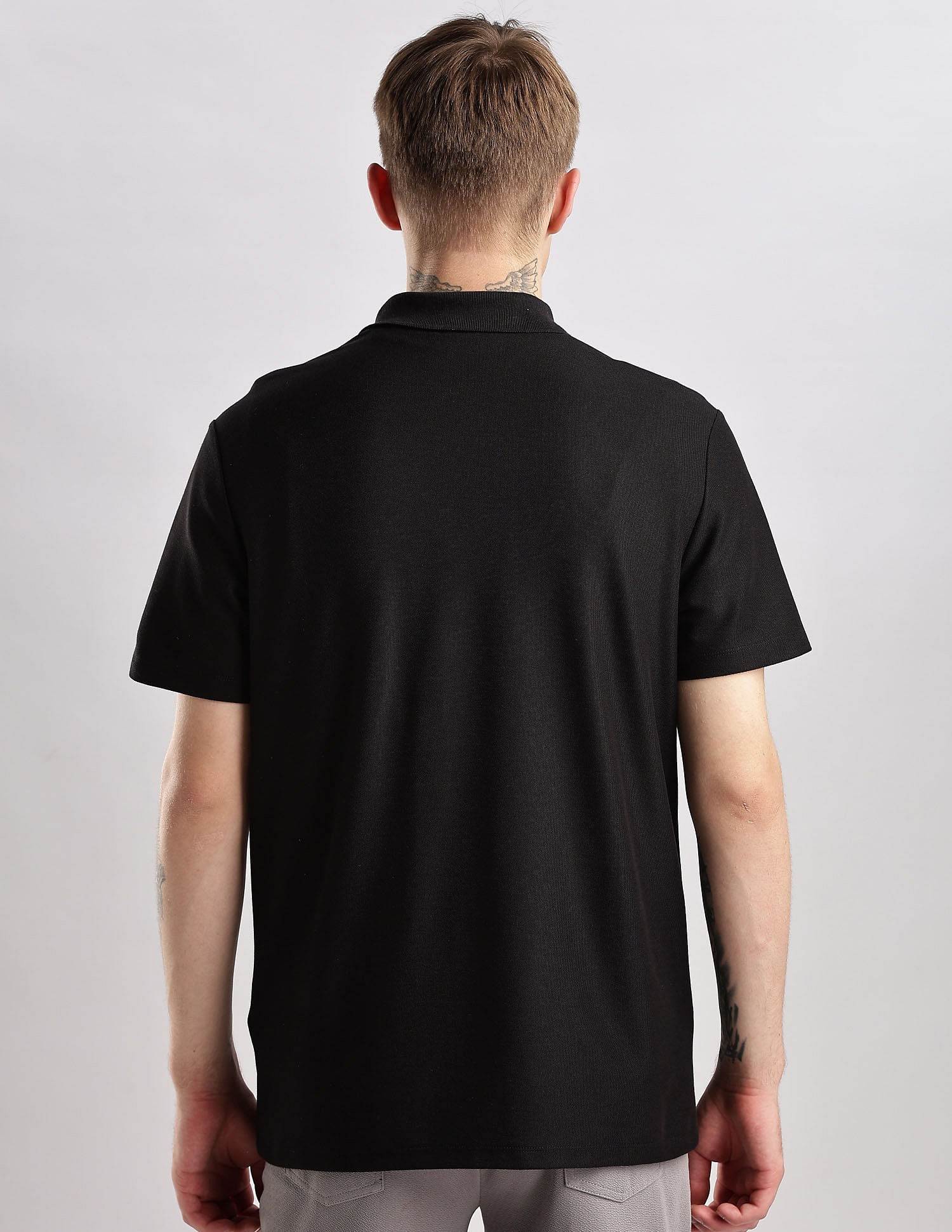 Calvin Klein Jeans Mens Black Solid Polo Shirts