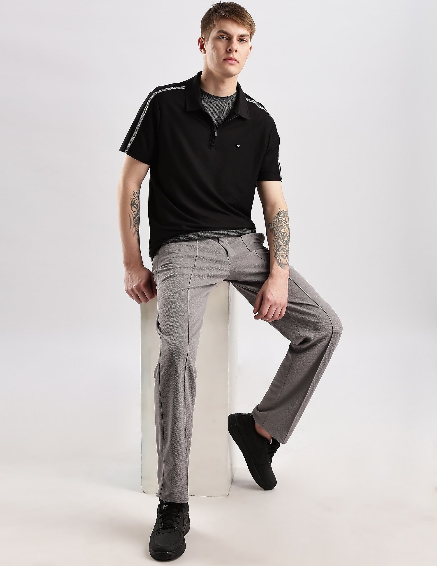 Calvin Klein Jeans Mens Black Solid Polo Shirts