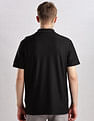 Calvin Klein Jeans Mens Black Solid Polo Shirts